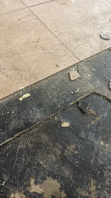 Black bitumen mastic floor removal in a SE6 flat
